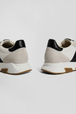 Basket en cuir blanches et marine à semelles crantées