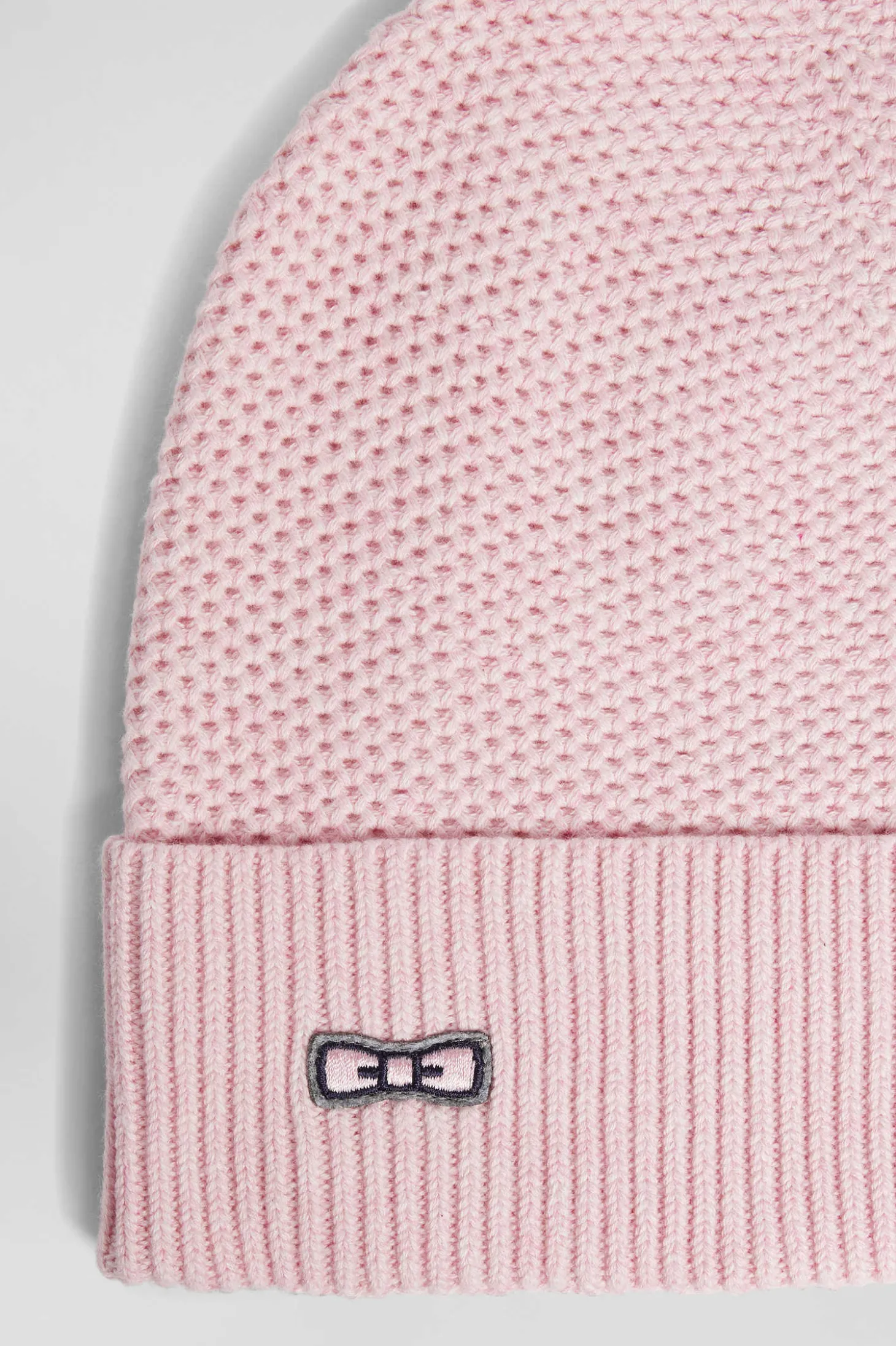 Bonnet uni en coton tricoté rose
