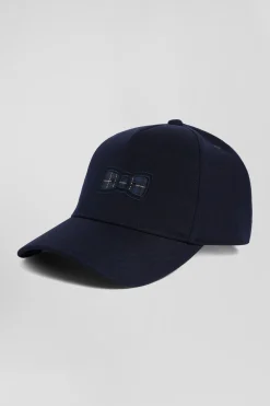 Casquette bleu marine emblème nœud papillon