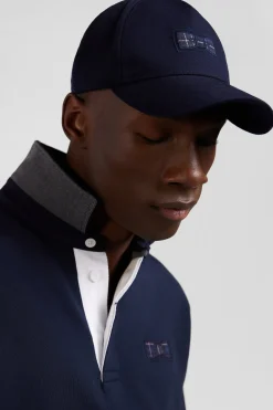 Casquette bleu marine emblème nœud papillon