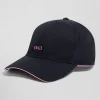 Casquette en coton bleu marine badge nœud papillon passepoil rose