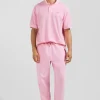 Jogging unisexe en molleton coton rose surteint coupe Relaxed