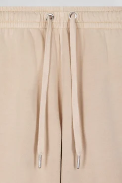 Jogging unisexe en molleton coton beige surteint coupe Relaxed