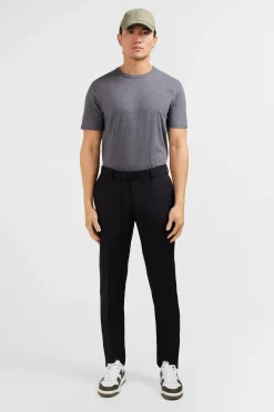 Pantalon slim noir en laine à plis cassés