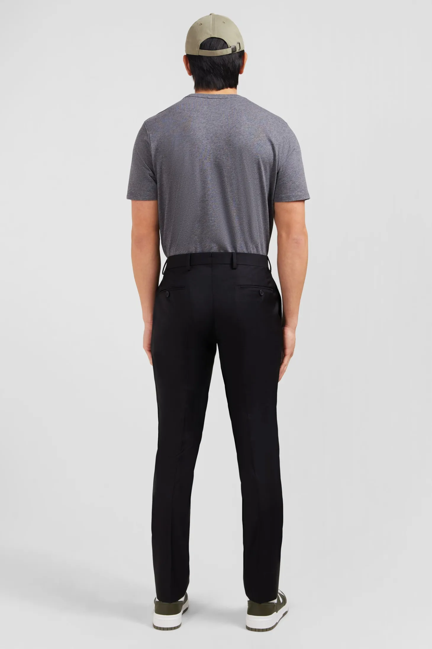 Pantalon slim noir en laine à plis cassés
