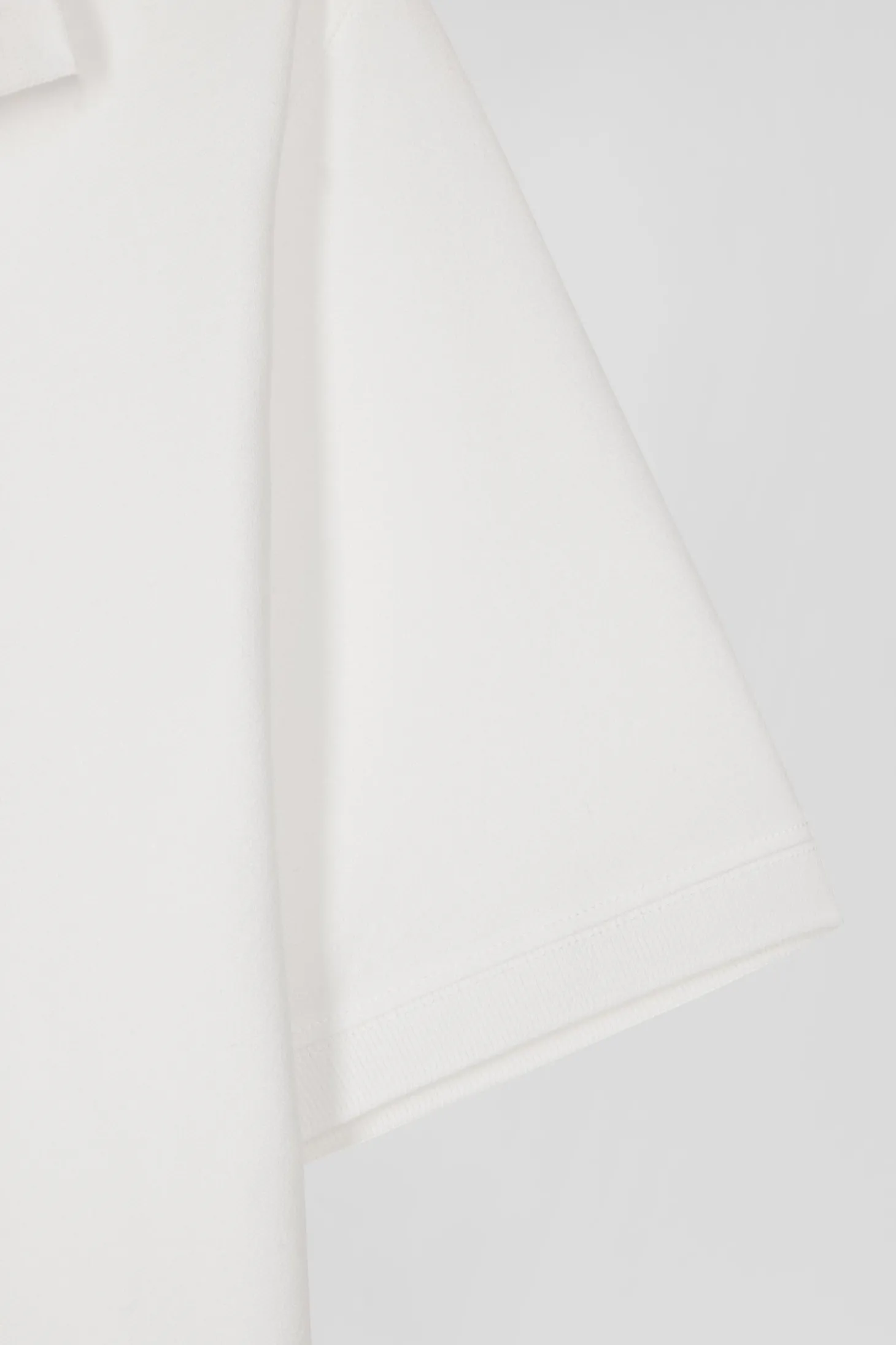 Polo manches courtes en coton stretch écru coupe Slim