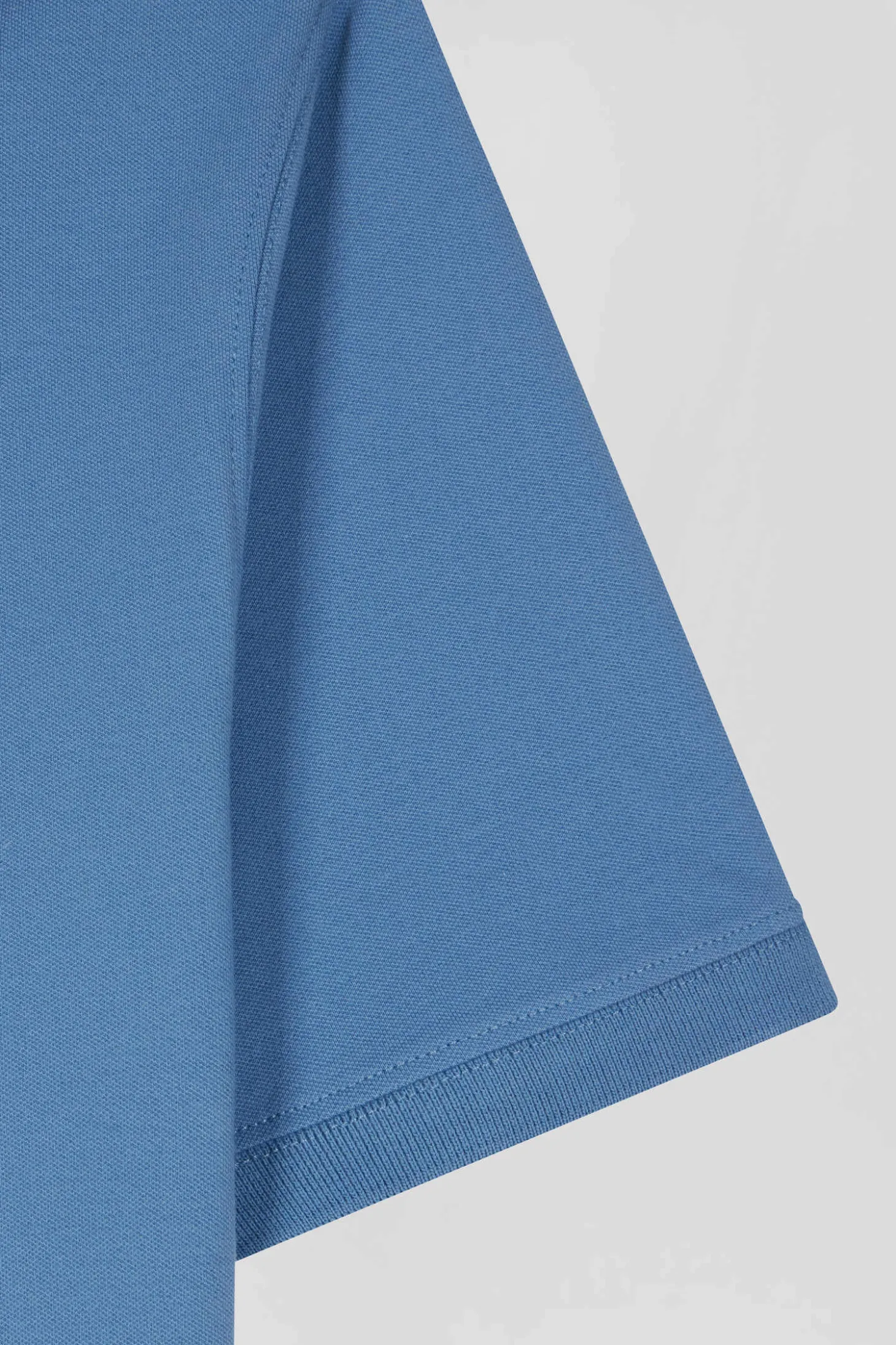 Polo manches courtes en coton stretch bleu coupe Slim