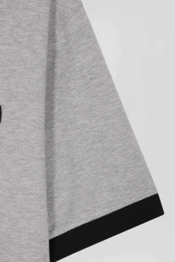 Polo manches courtes en piqué coton noir détails tricolores coupe Oversized