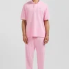 Polo manches courtes unisexe en piqué coton rose surteint coupe Oversized
