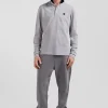Polo manches longues en piqué coton gris écusson gomme coupe Regular