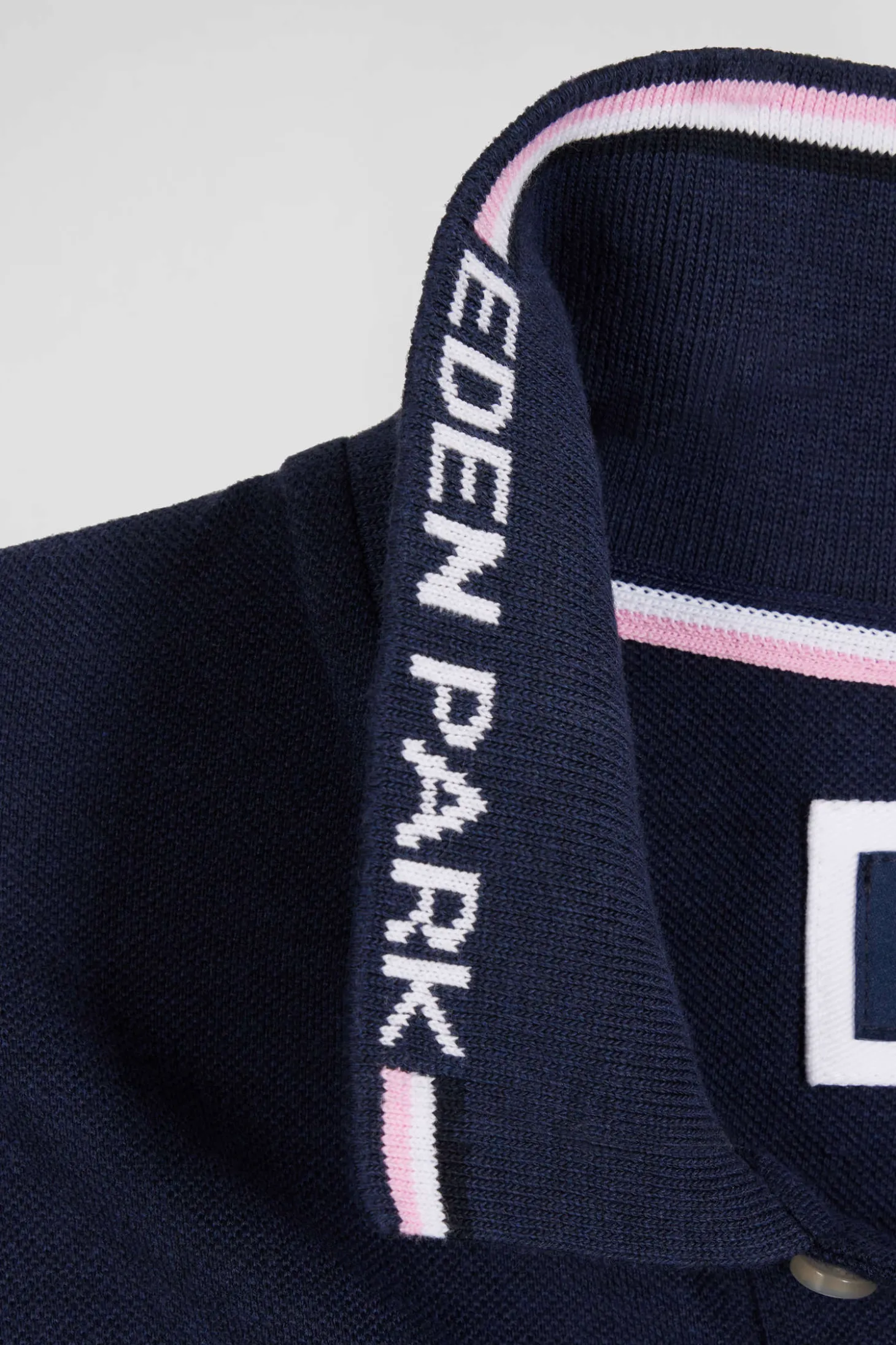 Polo manches longues en piqué coton bleu marine col jacquard écusson gomme coupe Regular