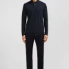 Polo manches longues noir uni en piqué de coton stretch